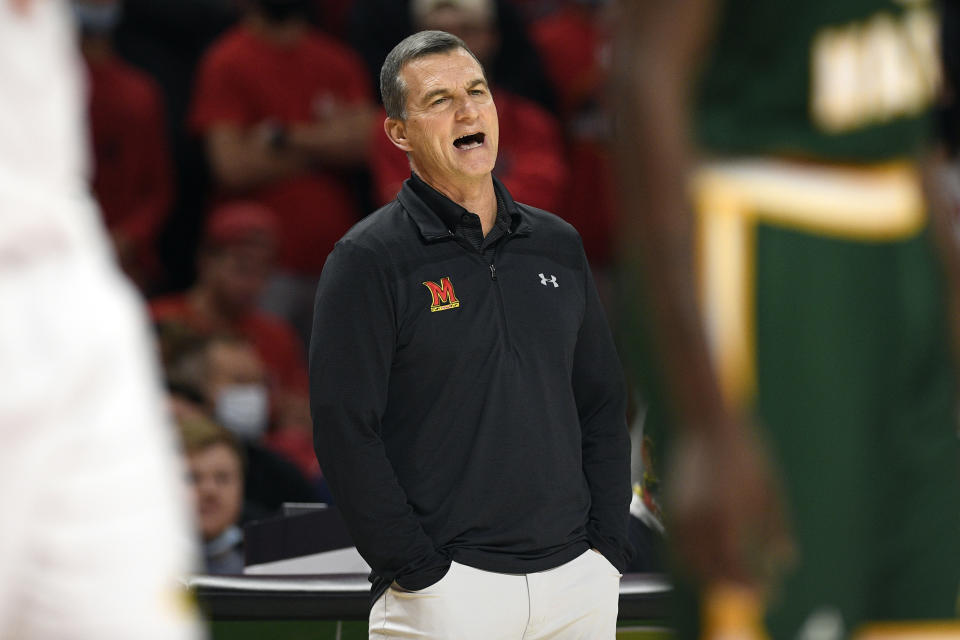 FILE - Maryland head coach Mark Turgeon reacts during the first half of an NCAA college basketball game against George Mason on Nov. 17, 2021, in College Park, Md. Turgeon is out as Maryland's basketball coach after a slow start to his 11th season knocked the team out of the Top 25. The athletic department announced Friday, Dec. 3, 2021, that Turgeon was stepping down in what it called a mutual decision. (AP Photo/Nick Wass, File)