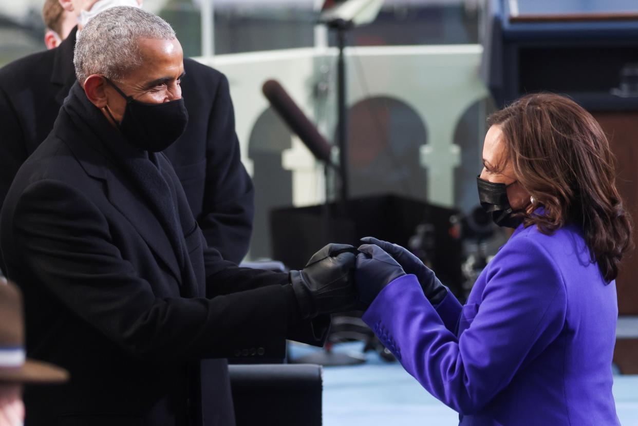 <p>Ms Harris shares a moment with Barack Obama, the first black president, at the inauguration</p> (REUTERS)