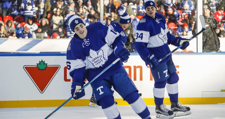 TORONTO, ON - JANUARY 1: Auston Matthews #34 and Mitch Marner #16 of the Toronto Maple Leafs take part in warmup before playing the Detroit Red Wings during the 2017 Scotiabank NHL Centennial Classic game at Exhibition Stadium on January 1, 2017 in Toronto, Ontario, Canada. (Photo by Mark Blinch/NHLI via Getty Images)
