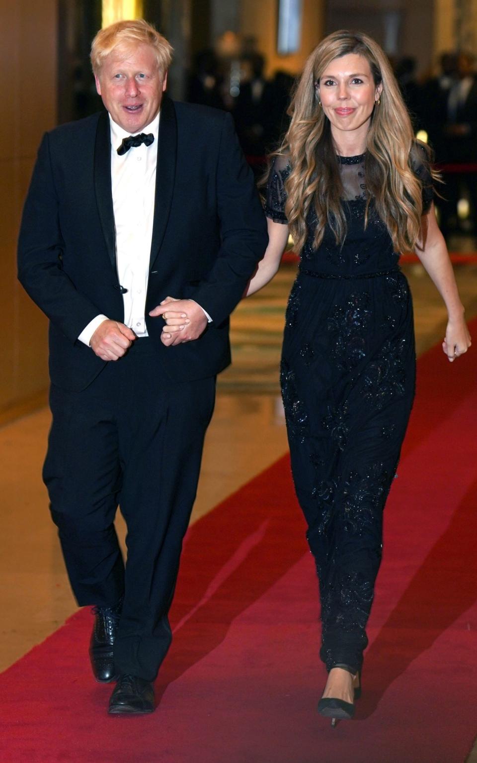 Prime Minister Boris Johnson and Carrie Johnson arrive for the Commonwealth Heads of Government Dinner - Jonathan Brady/PA Wire