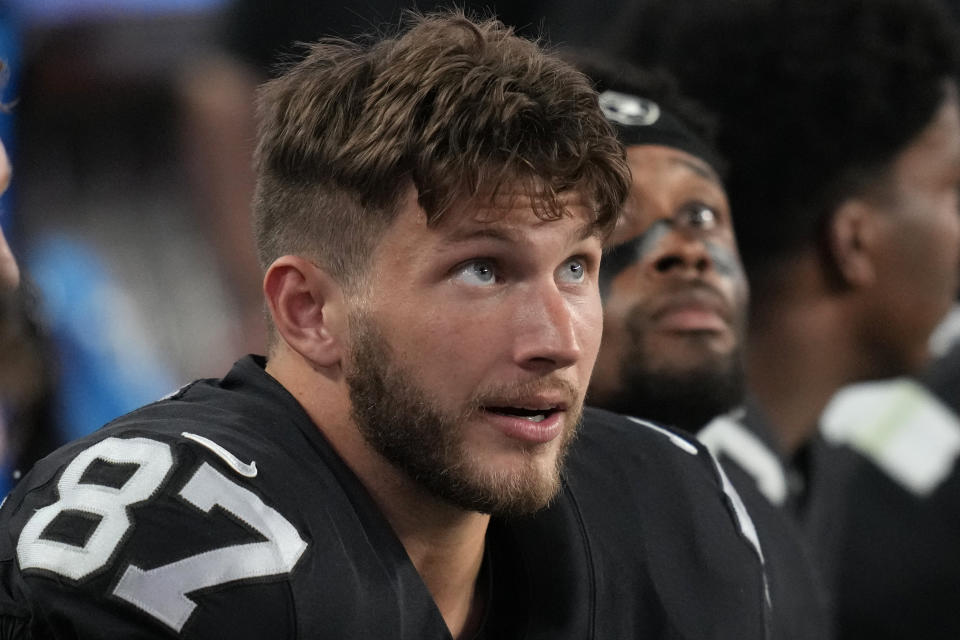 Las Vegas Raiders tight end Foster Moreau (87) on the sidelines against the New England Patriots during an NFL preseason football game, Friday, Aug. 26, 2022, in Las Vegas. (AP Photo/John Locher)