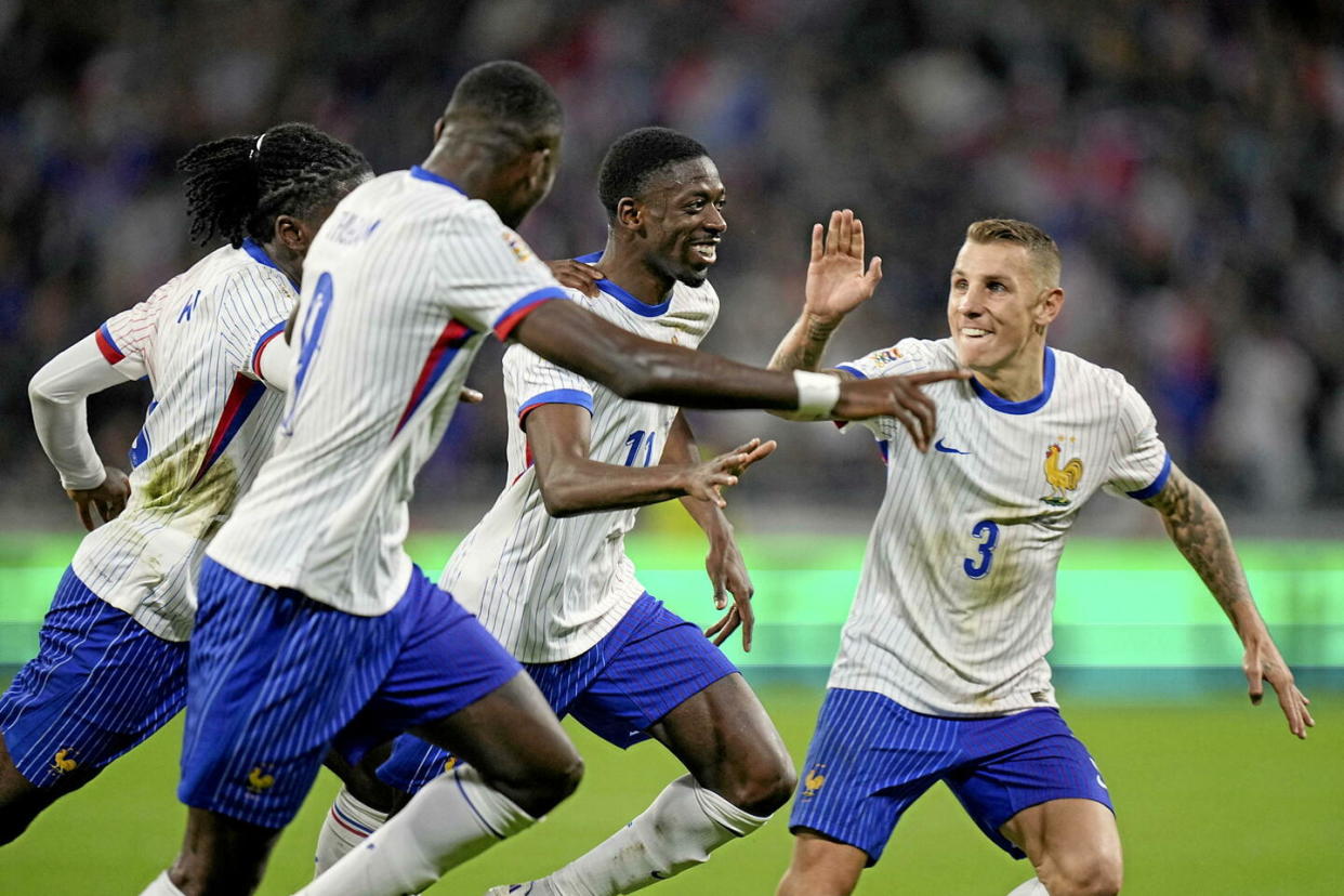 Ousmane Dembélé, deuxième à gauche, célèbre avec ses coéquipiers après avoir marqué le deuxième but de son équipe lors du match de football de la Ligue des Nations de l'UEFA entre la France et la Belgique au stade Groupama de Décines, à l'extérieur de Lyon, en France, le lundi 9 septembre 2024. (AP Photo /Laurent Cipriani)/XTS129/24253732072009//2409092224 - Crédit : Laurent Cipriani/AP/SIPA / SIPA / Laurent Cipriani/AP/SIPA