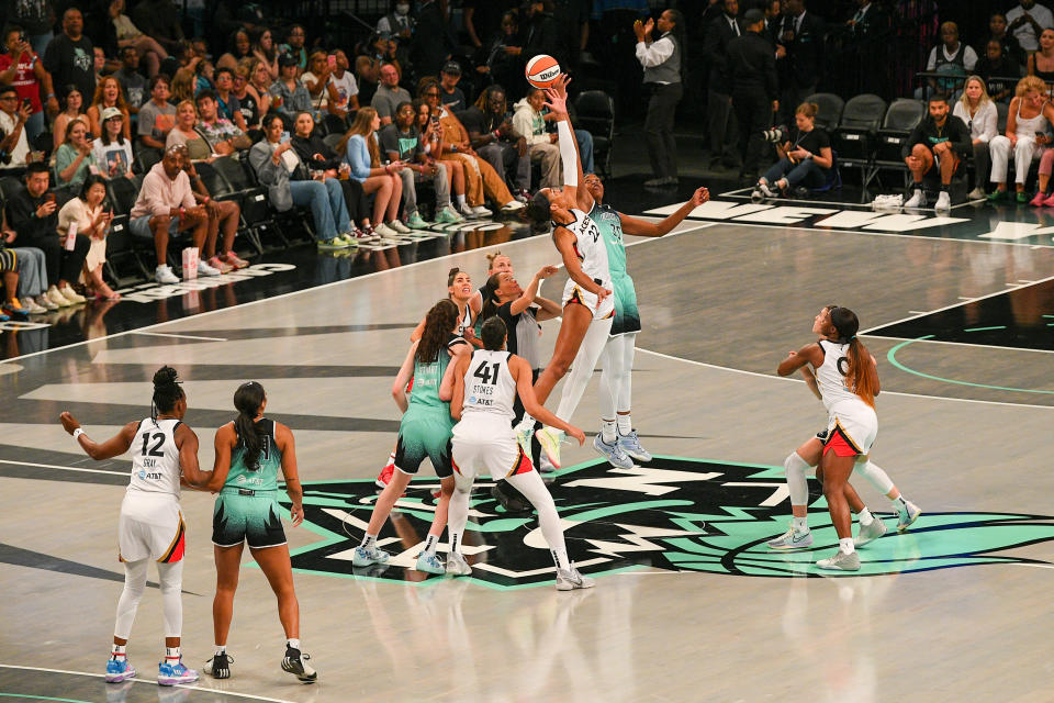 Las Vegas Aces forward A'ja Wilson and New York Liberty forward Jonquel Jones reach for the ball during the opening tip on Aug. 6, 2023, at Barclays Center in New York. (Erica Denhoff/Icon Sportswire via Getty Images)