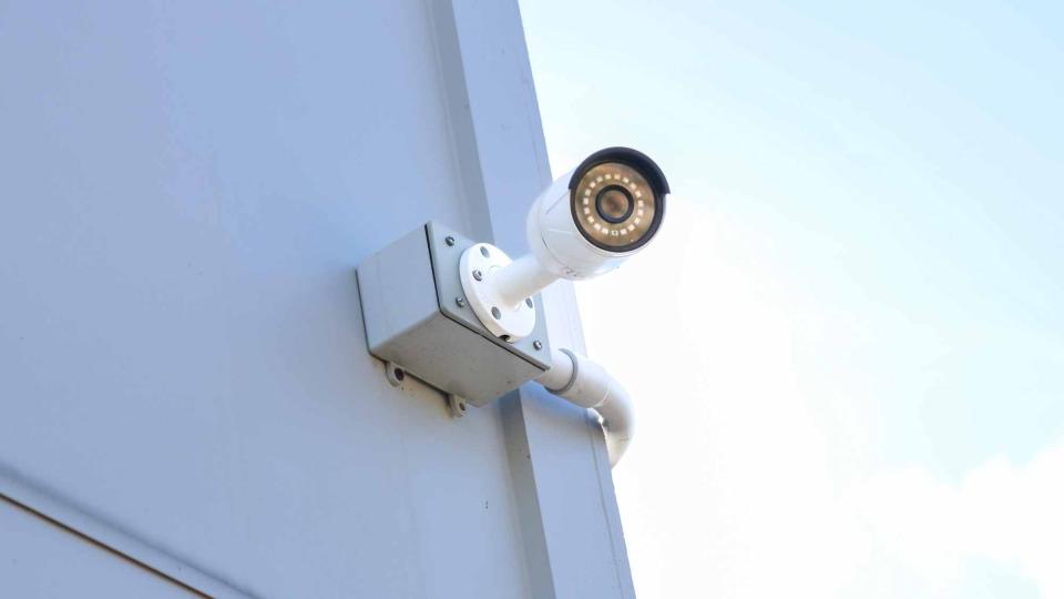 A Reolink PoE camera mounted to the side of a house