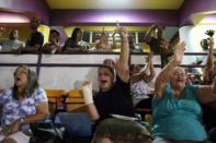 Fans attend a baseball game between Los Artesanos de Las Piedras and Los Halcones de Gurabo during the Puerto Rico Double A baseball league at Las Piedras, Puerto Rico, June 11, 2016. REUTERS/Alvin Baez