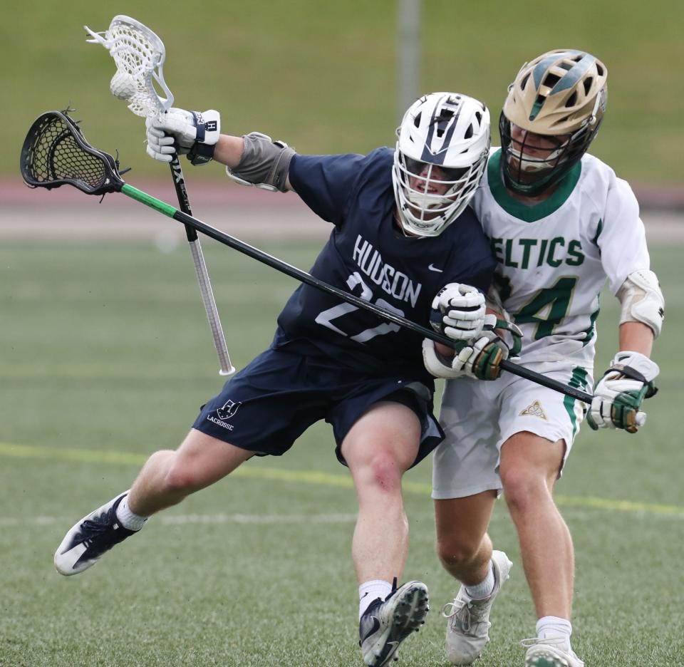 Hudson's Vince Matolka collides with Dublin Jerome's Seth Siddle during the first quarter of the Division I state semifinal lacrosse game at Ashland University's Ferguson Field in Ashland. Hudson lost 18-9.