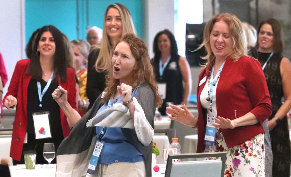 Attendees react to Pegine's high-energy motivational speech to open the third-annual two-day Boss Lady Women's Leadership Conference on Thursday, Sept. 14, 2023 at the Daytona Grande Oceanfront Resort in Daytona Beach.