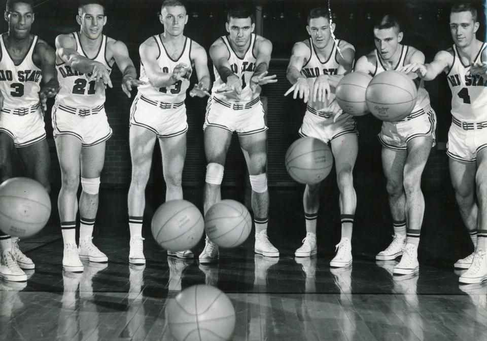 Seven Ohio State men's basketball players who were members of the 1960 national champion team, left to right, Mel Nowell, Larry Siegfried, Richie Hoyt, Jerry Lucas, John Havlicek, Bob Knight and Gary Gearhart.
