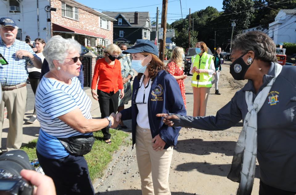 New York Governor Kathy Hochul greets homeowner Judith Garan along Warburton Avenue in Yonkers Sept. 3, 2021. She was there to check out the devastation that occurred after rivers of mud and water washed away the backyards of the city residents. 