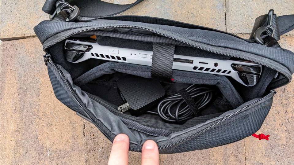 Tomtoc Carrying Case with ROG Aly and charging cable inside.