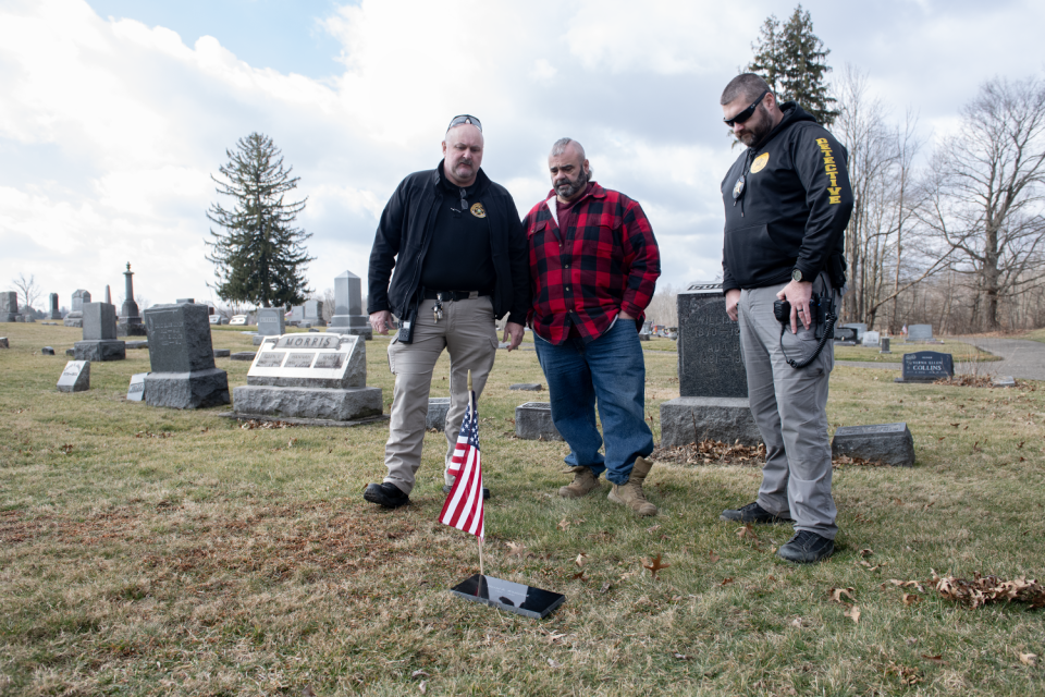 Paris Township trustee Ed Samec, center, worked to get a headstone for David Kaziateck after an investigation by Portage County sheriff's detectives Trent Springer and Karl Balasz led to Kaziateck's identification as the John Doe buried in Hawley Cemetery since 1988.