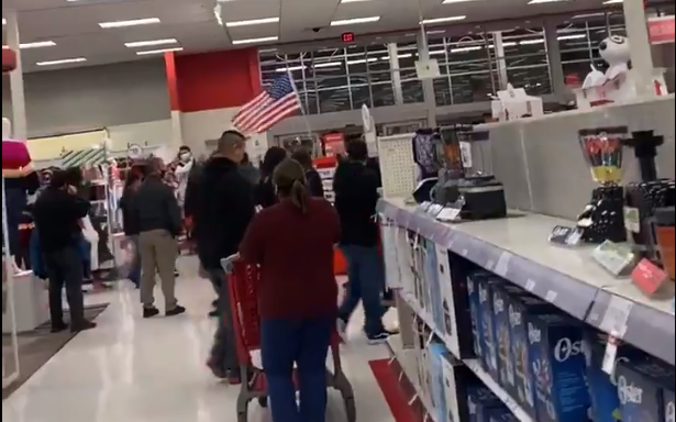 Anti-mask protestors march throughout a Phoenix Target store on Dec. 17, 2020.