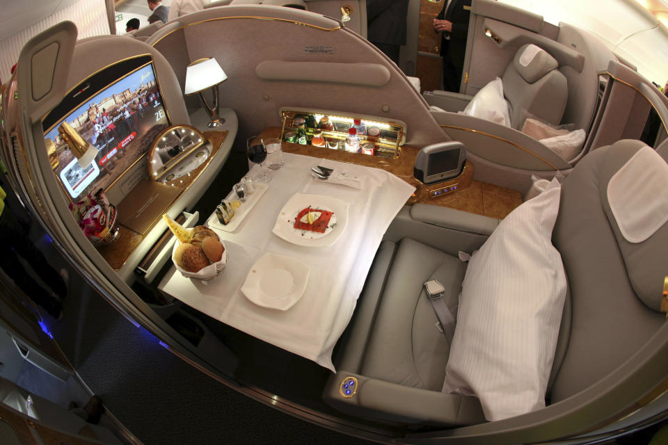 FILE- This Sept. 1, 2010, wide angle file photo shows a first class cabin is seen on an Emirates A380 airplane at Manchester Airport after the plane's arrival on a flight from Dubai, in Manchester, England. European plane maker Airbus said Thursday, Feb. 14, 2019, that it will stop making its superjumbo A380 in 2021 for lack of customers, abandoning the world's biggest passenger jet and one of the aviation industry's most ambitious and most troubled endeavors. (AP Photo/Jon Super, File)