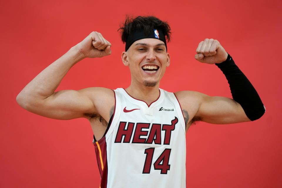 Miami Heat guard Tyler Herro (14) poses for a photographer during the NBA basketball team's media day, in Miami, Monday, Oct. 2, 2023. (AP Photo/Rebecca Blackwell)