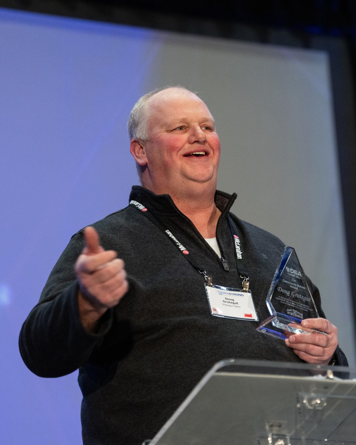 Doug Grotegut accepted the inaugural Community Builder Award from Dairy Business Association President Lee Kinnard and Chad Vincent, CEO of Dairy Farmers of Wisconsin, Jan. 17 during DBA’s Dairy Strong conference at the KI Convention Center in Green Bay.