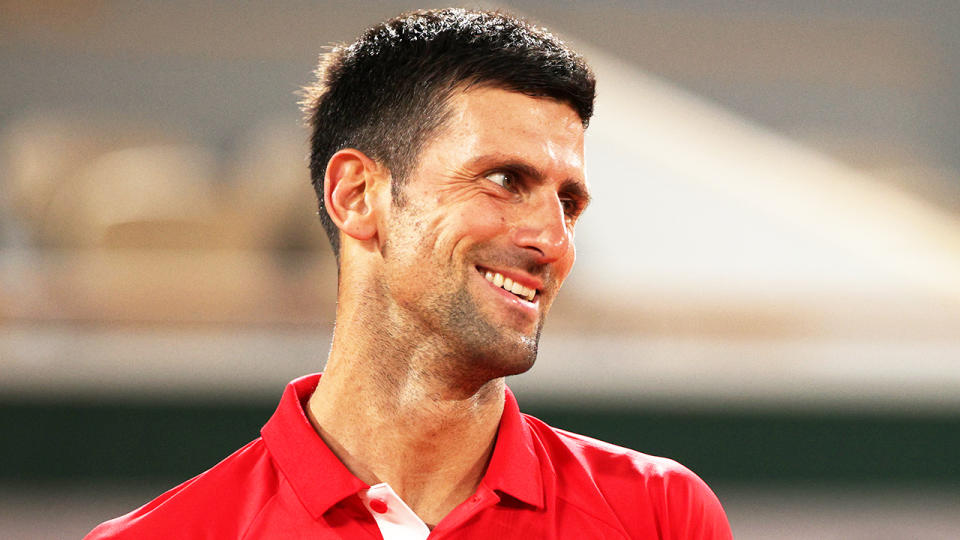 Novak Djokovic (pictured) smiling after a point at the French Open First Round.