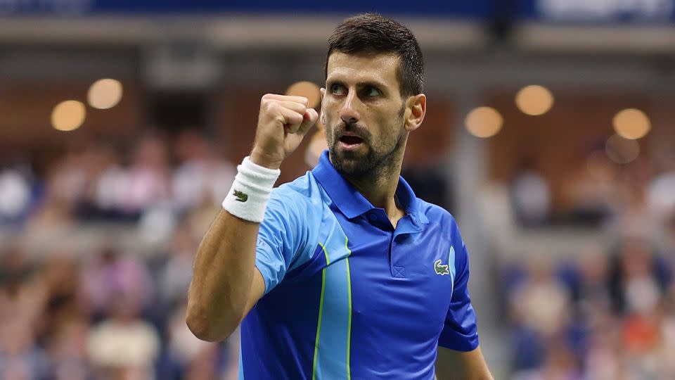 Djokovic celebrates a point against Medvedev. - Clive Brunskill/Getty Images