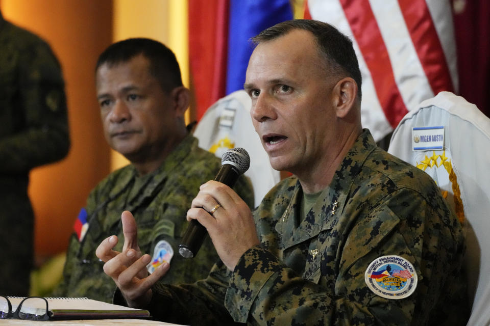 U.S. Marine Corps MGEN Eric Austin, U.S. Exercise Director Representative, right, speaks, sitting beside Philippine Army MGEN Marvin Licudin, Philippine Exercise Director, during a news conference at the opening ceremonies of a joint military exercise flag called "Balikatan," a Tagalog word for "shoulder-to-shoulder," at Camp Aguinaldo military headquarters Tuesday, April 11, 2023, in Quezon City, Philippines. The United States and the Philippines on Tuesday launch their largest combat exercises in decades that will involve live-fire drills, including a boat-sinking rocket assault in waters across the South China Sea and the Taiwan Strait that will likely inflame China. (AP Photo/Aaron Favila)