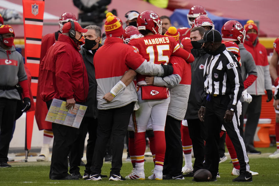 Kansas City Chiefs quarterback Patrick Mahomes (15) is helped off the field after getting injured during the second half of an NFL divisional round football game against the Cleveland Browns, Sunday, Jan. 17, 2021, in Kansas City. (AP Photo/Jeff Roberson)