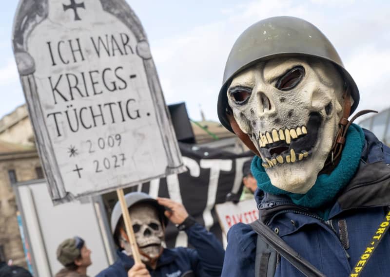 Demonstrators take part in a protest under the slogan "Against the NATO war conference" in Munich city center on the sidelines of the 60th Munich Security Conference. Peter Kneffel/dpa