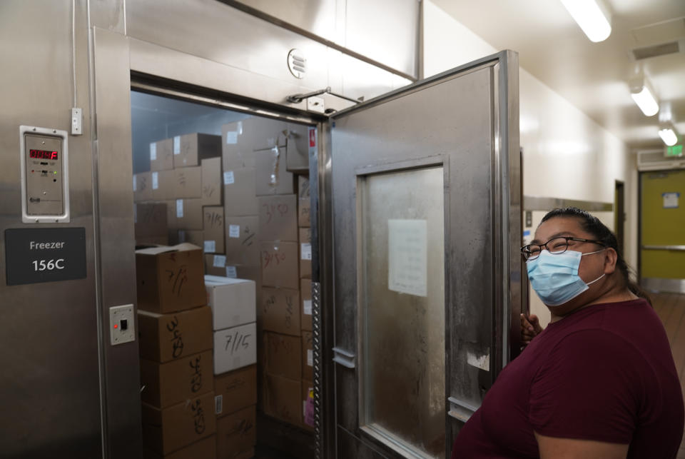 Los Angeles Unified School District Food Service manager Rosa Garcia checks food stocks in a walk-in freezer for free school meals on Thursday, July 15, 2021, at the Liechty Middle School in Los Angeles. Flush with cash from an unexpected budget surplus, California is launching the nation's largest statewide universal free lunch program. When classrooms open for the fall term, every one of California's 6.2 million public school students will have the option to eat school meals for free, regardless of their family's income. (AP Photo/Damian Dovarganes)