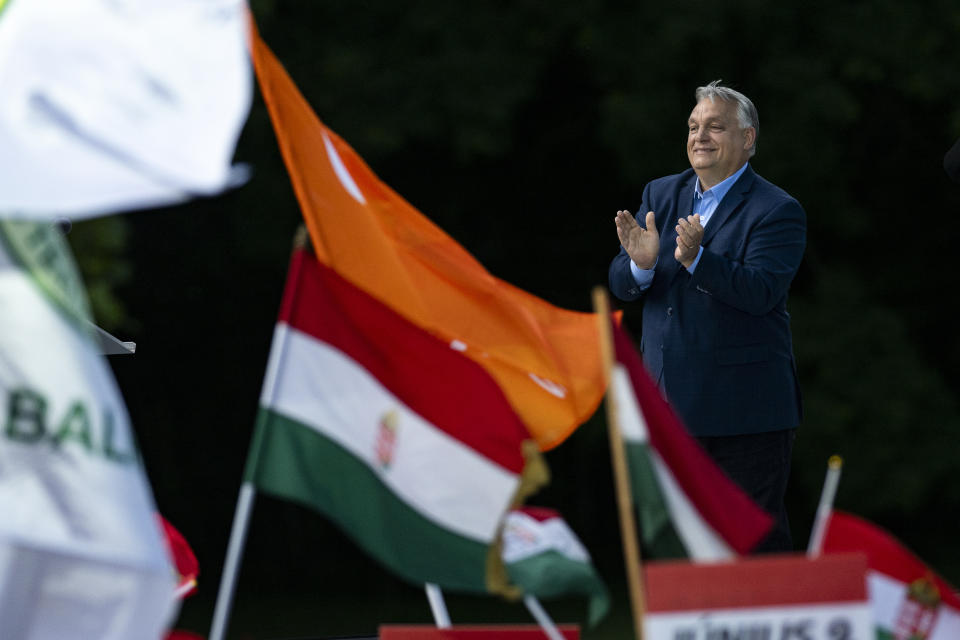 Hungary's Prime Minister Viktor Orbán addresses people as they gather to support him and his party during a "peace march" in Budapest, Hungary, Saturday, June 1, 2024. A crowd of tens of thousands gathered in Hungary’s capital on Saturday in a show of strength behind Orbán a week ahead of European Parliament elections, a contest that he has cast as an existential turning point between peace and a world war. (AP Photo/Denes Erdos)