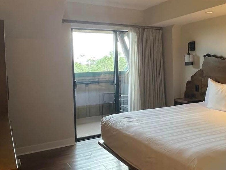 view of the bedroom and the balcony in a villa at disney's wilderness lodge