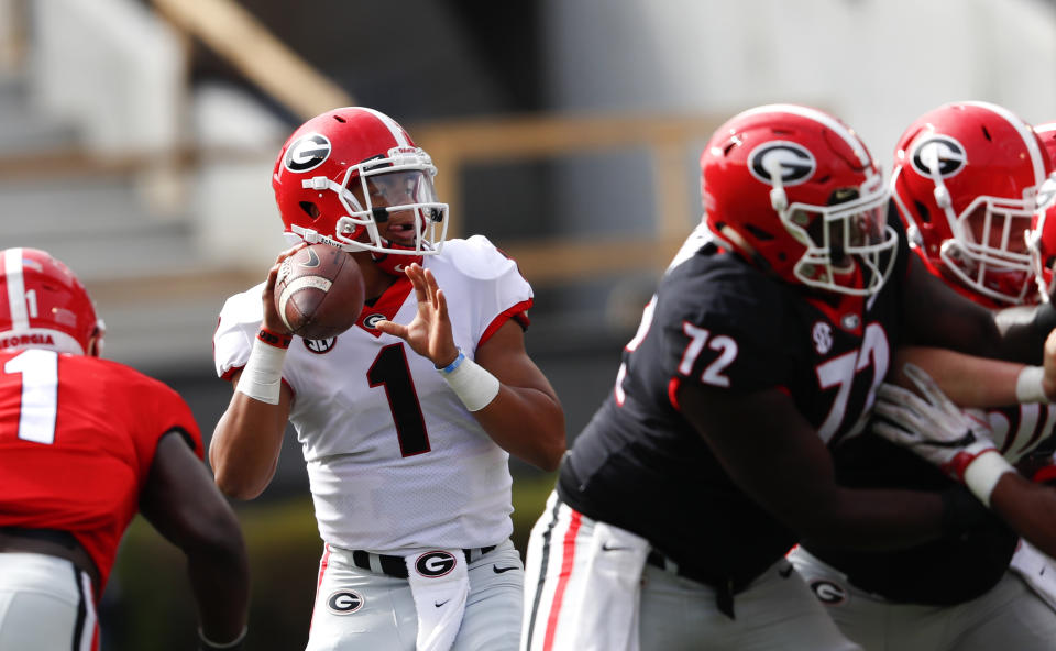 Quarterback Justin Fields throws a pass during during the first half of Georgia’s annual G Day inter squad spring football game Saturday, April 21, 2018, in Athens, Ga. (AP Photo/John Bazemore)