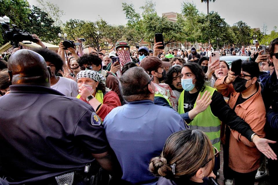 Protesters and officers confront each other during the dispersing of the USC protest (Copyright 2024 The Associated Press. All rights reserved)
