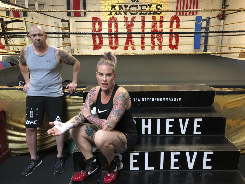 In this Thursday, Aug. 16, 2018 photo Bec Rawlings, of Australia, prepares for a bare-knuckle sparring session with her trainer John Bastable, at City of Angels Boxing Club in Los Angeles. Rawlings is a longtime UFC fighter who will fight on the second sanctioned bare-knuckle boxing show in the U.S. in over a century on Saturday, Aug. 25, in Biloxi, Miss. (AP Photo/Greg Beacham)