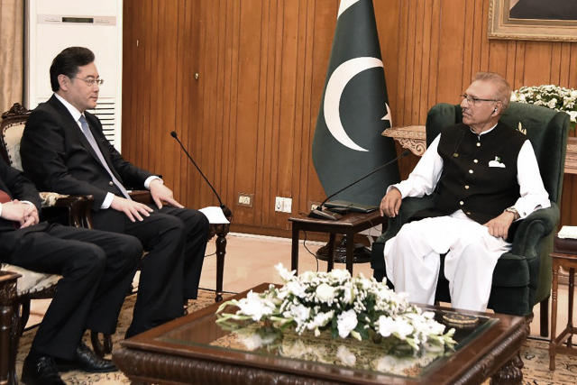 In this photo released by Pakistan's President office, visiting Chinese Foreign Minister Qin Gang meets with Pakistani President Arif Alvi, in Islamabad, Pakistan, Friday, May 5, 2023. The Pakistani president on Friday assured Beijing's top diplomat that his country will boost security for all Chinese nationals working on multi-billion dollar projects in cash-strapped Pakistan. (Pakistan President Office via AP)