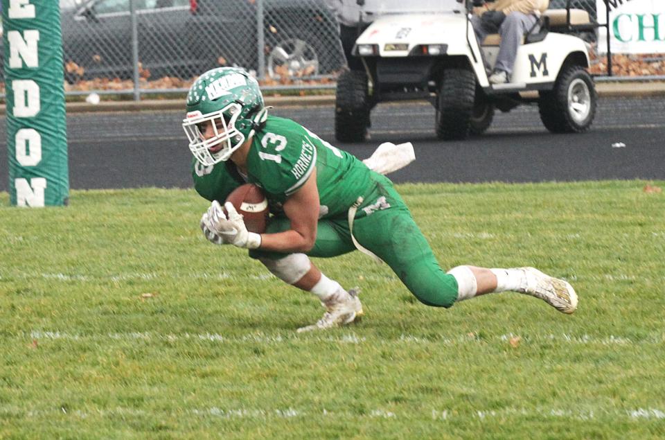 Nic Stiver of Mendon intercepts a pass near the goal line to stop a Morrice drive right behind halftime on Saturday.