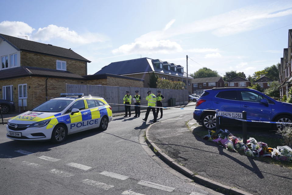 Police officers at the scene in Ashlyn Close where three women were killed in a crossbow attack at their home, on Tuesday, in Bushey, England, Thursday, July 11, 2024. A man suspected of killing the wife and daughters of a BBC radio sports commentator with a crossbow is being treated in a hospital after being found injured in a cemetery. Kyle Clifford is suspected of attacking Carol Hunt, 61, and her daughters Hannah, 28 and Louise, 25. They were found dead at their home in Bushey, a suburban community northwest of London. (Jonathan Brady/PA via AP)