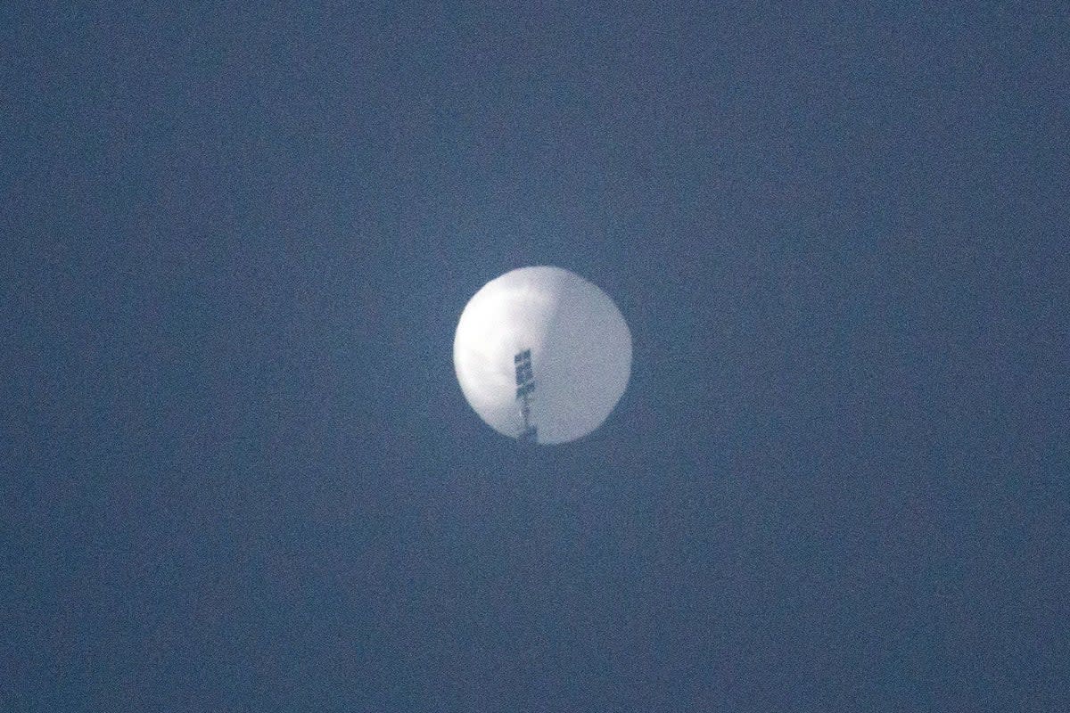 In this file photo taken on 1 Feb 2023 and released on 2 February shows a suspected Chinese spy balloon in the sky over Billings, Montana (CHASE DOAK/AFP via Getty Images)