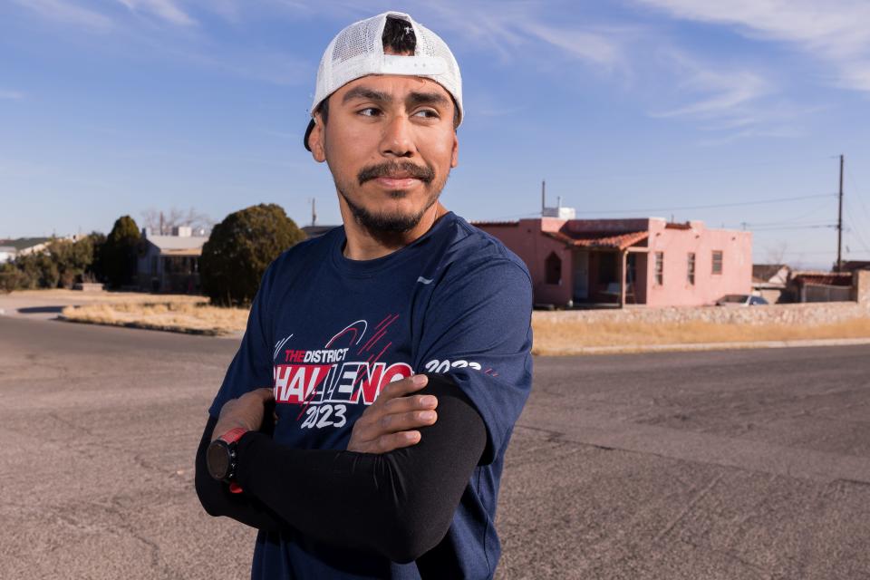 Gonzalo Espinoza, a groundskeeper for Ysleta ISD, poses for a photo in the street at Central El Paso, where he trains for the El Paso Marathon on Friday, Feb. 3, 2023. Espinoza finished in the top 10 in the past two El Paso Marathons.