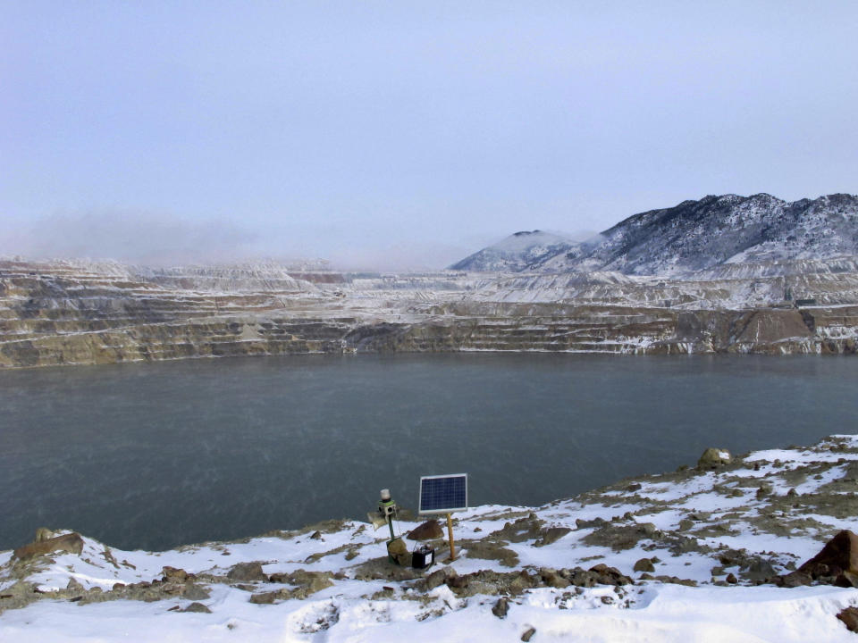 FILE - In this Dec. 14, 2016, file photo, a Phoenix Wailer bird deterrent sits on the bank of the Berkeley Pit in Butte, Mont. The wailer, which emits different sounds at random times, is one of the devices used to keep birds from landing in the toxic water of the former copper mine. The Trump administration is moving to scale back criminal enforcement of a century-old law protecting most American wild bird species. (AP Photo/Matt Volz, File)