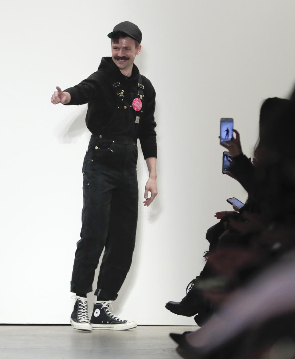 Designer Adam Selman acknowledges applause from the audience after his fashion collection was modeled during Fashion Week, Thursday, Feb. 9, 2017, in New York. (AP Photo/Julie Jacobson)