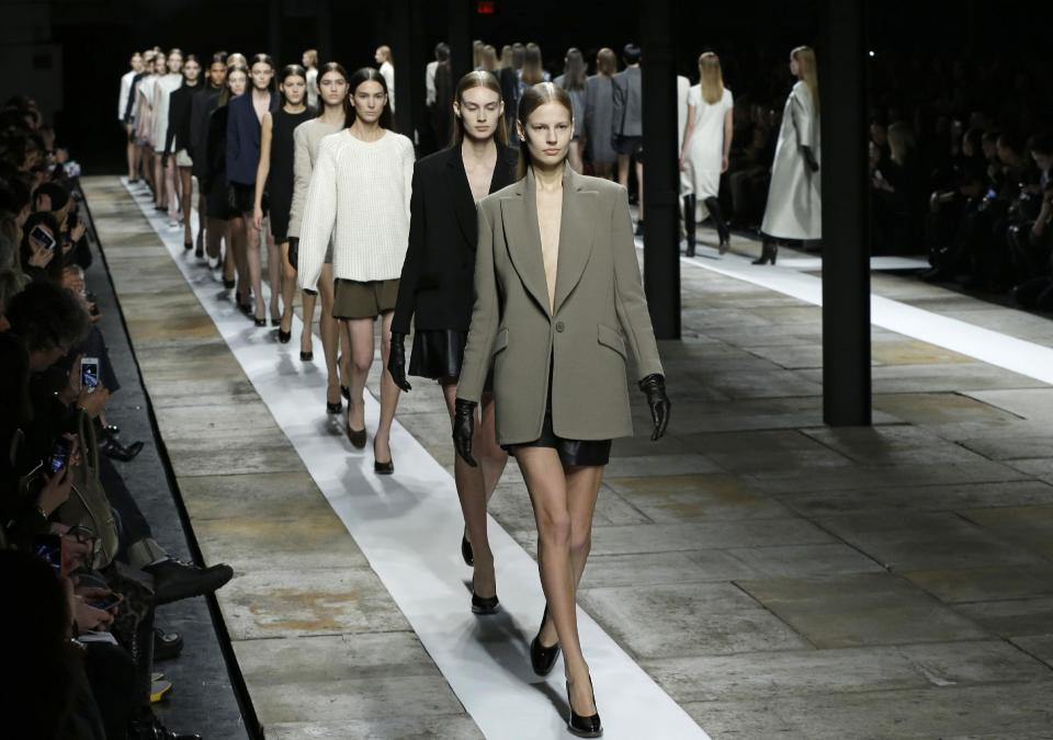 Models parade at the conclusion of the Theyskens Theory Fall 2013 runway show at Fashion Week in New York, Monday, Feb. 11, 2013. (AP Photo/Kathy Willens)