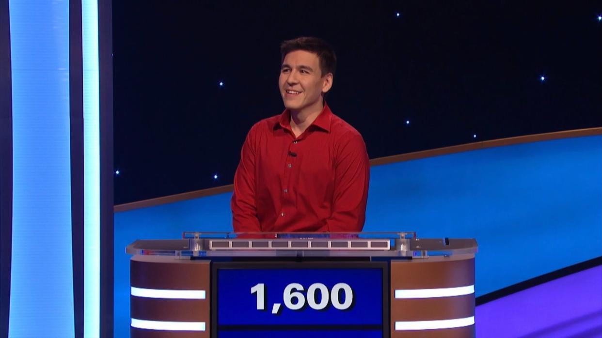 James Holzhauer in a red shirt with a slight smile