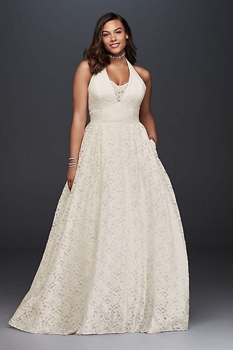 <i>Dress by <a href="http://www.davidsbridal.com/Product_plunging-lace-halter-plus-size-wedding-dress-9wg3844" target="_blank">Galina via David's Bridal&nbsp;</a></i>