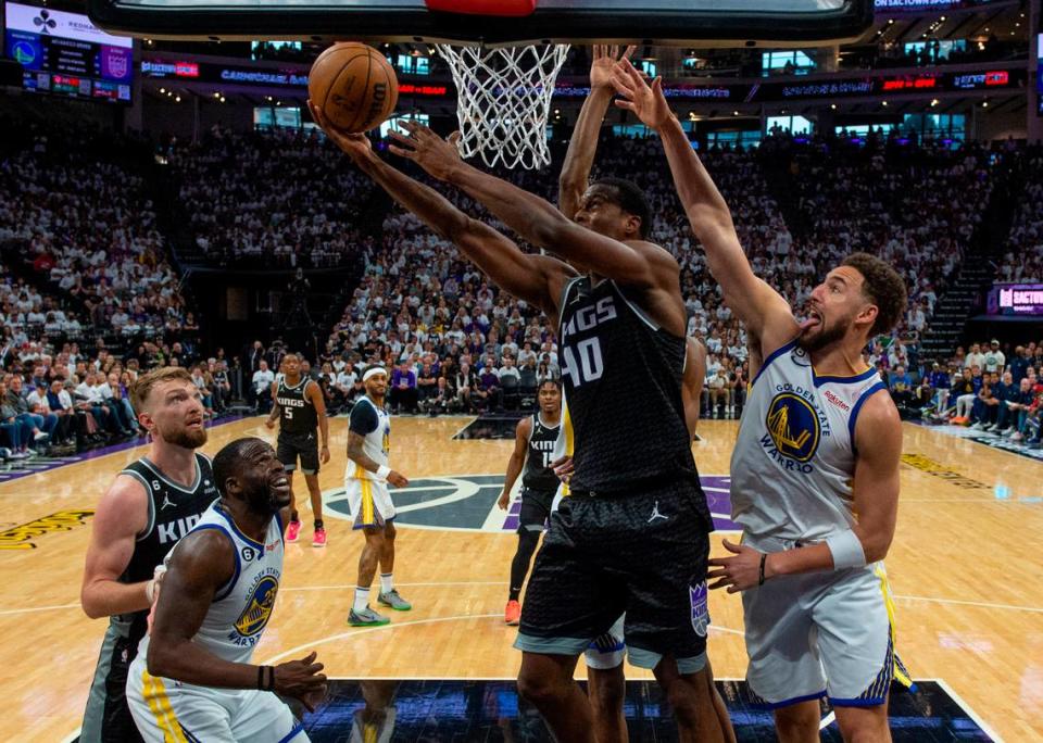 Sacramento Kings forward Harrison Barnes (40) scores a basket defended by Golden State Warriors guard Klay Thompson (11) during Game 1 of the first-round NBA playoff series at Golden 1 Center on Saturday, April 15, 2023.