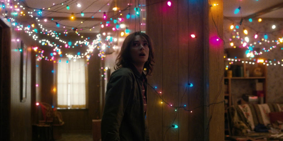 Joyce Byers (played by Winona Ryder) illuminates her living room with Christmas lights to prove that Will is trying to talk to her from the Upside Down. — Picture courtesy of Netflix