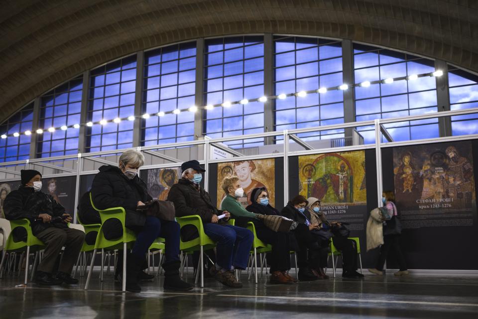 People rest and are watched to control possible side effects after receiving a dose of a Covid-19 vaccine in the Belgrade Fair turned into a vaccination centre on February 12, 2021. - Inside the dome of Belgrade's fairgrounds, dozens of nurses in protective suits inject Covid-19 jabs into young and old alike, working with an efficiency that has turned Serbia into continental Europe's fastest vaccinator. The small Balkan country has inoculated more than 500,000 of its seven million population in almost two weeks, a rate that exceeds all countries in Europe outside the United Kingdom, according to the scientific publication Our World in Data. (Photo by Andrej ISAKOVIC / AFP) (Photo by ANDREJ ISAKOVIC/AFP via Getty Images)