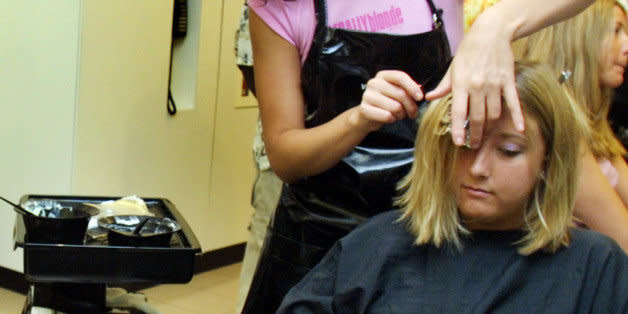 391650 02: Lorraine Connelly checks her hair in a mirror as Laura Walz gets a hair color treatment by Tey Medina at the Vidal Sasson Salon July 9, 2001 in Miami Beach, Florida. The women colored their hair blonde for National Blonde Day. The salon gave free color jobs in recognition of the day. (Photo by Joe Raedle/Getty Images) (Photo: )