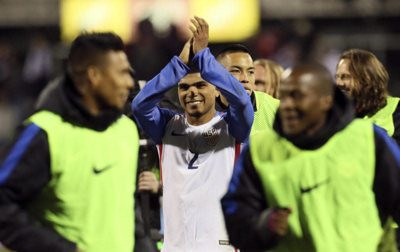 Team USA's DeAndre Yedlin salutes the crowd after Team USA beat Guatemala 4-0 in a World Cup qualifier at MAPFRE Stadium on Tuesday in Columbus. (Michael Chritton/Akron Beacon Journal)