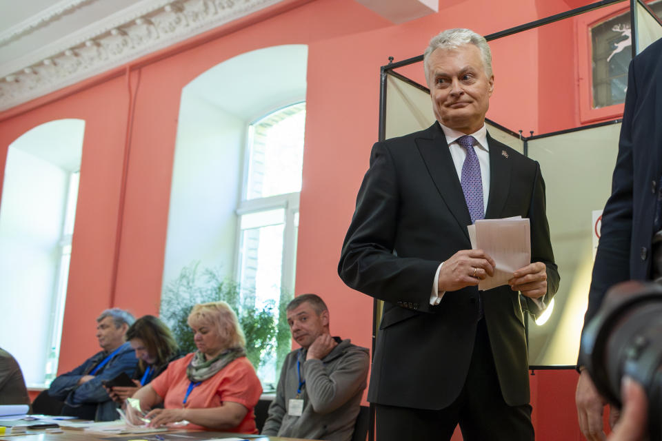 Lithuania's President Gitanas Nauseda, a presidential candidate, leaves a voting booth at a polling station during the first round of voting in presidential elections in Vilnius, Lithuania, Sunday, May 12, 2024. (AP Photo/Mindaugas Kulbis)