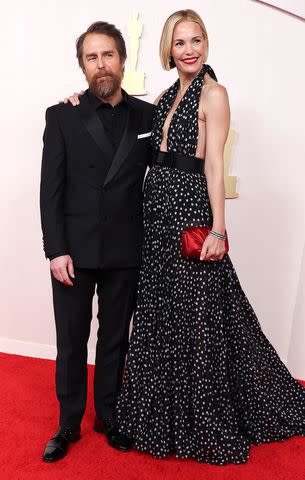 <p>Kevin Mazur/Getty</p> Sam Rockwell and Leslie Bibb