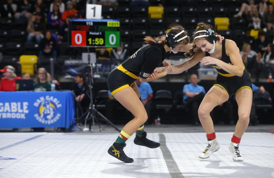 Sigourney-Keota's Reanah Utterback wrestles Bettendort's Taylor Strief Friday, Dec. 1, 2023 during the Dan Gable Donnybrook wrestling tournament at Xtream Arena in Coralville, Iowa..