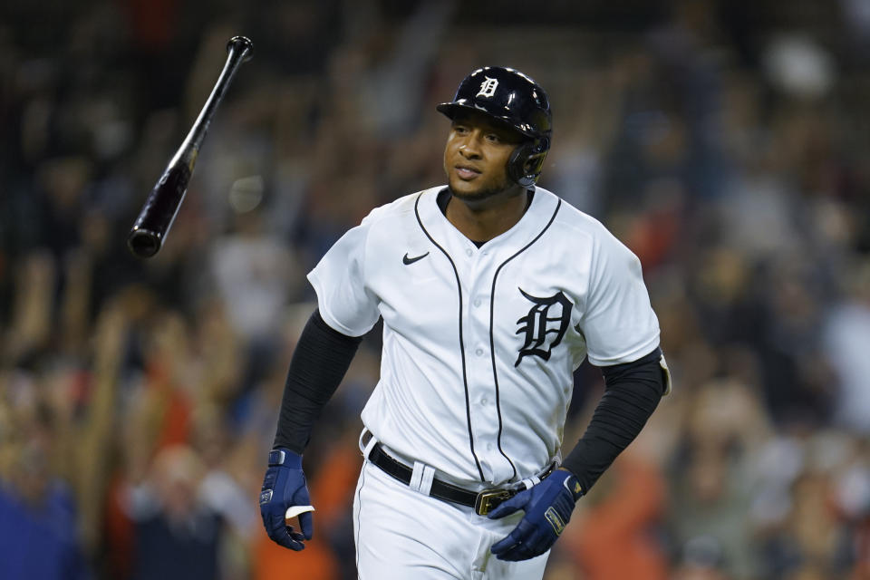 Detroit Tigers' Jonathan Schoop tosses his bat after hitting a grand slam against the Tampa Bay Rays in the seventh inning of a baseball game in Detroit, Friday, Sept. 10, 2021. (AP Photo/Paul Sancya)