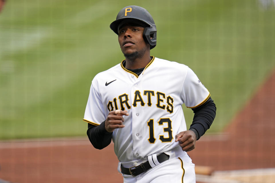 Pittsburgh Pirates' Ke'Bryan Hayes heads back to the dugout after scoring from third on a groundout by Andrew McCutchen off Cincinnati Reds starting pitcher Hunter Greene during the first inning of baseball game in Pittsburgh, Sunday, April 23, 2023. (AP Photo/Gene J. Puskar)